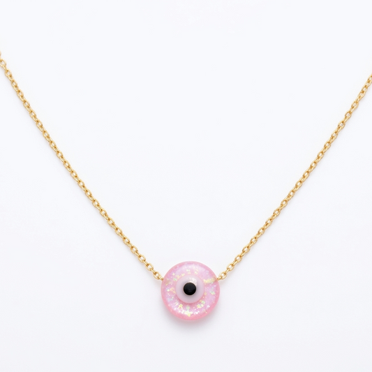Necklace with a pink pendant on a white background