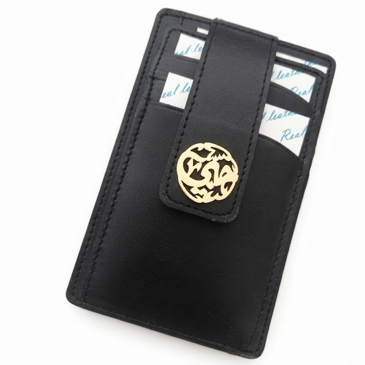 A black leather card holder wallet with a gold circular arabic calligraphy name, shown on a plain white background.