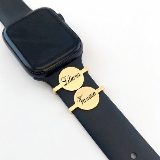 Black smartwatch with gold nameplates on a white background