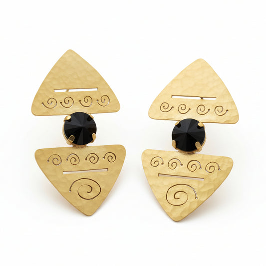 Pair of gold triangle-shaped earrings with black centers on a white background
