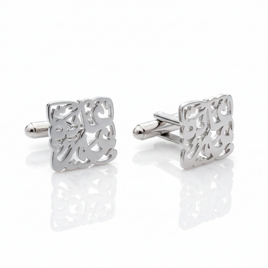 Pair of silver square cufflinks with arabic calligraphy design on a white background