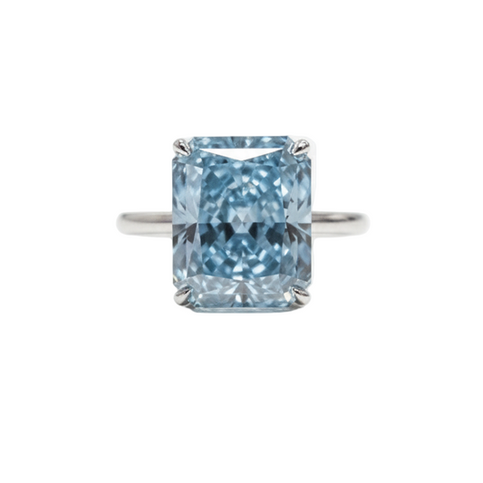 Blue diamond ring on a white background