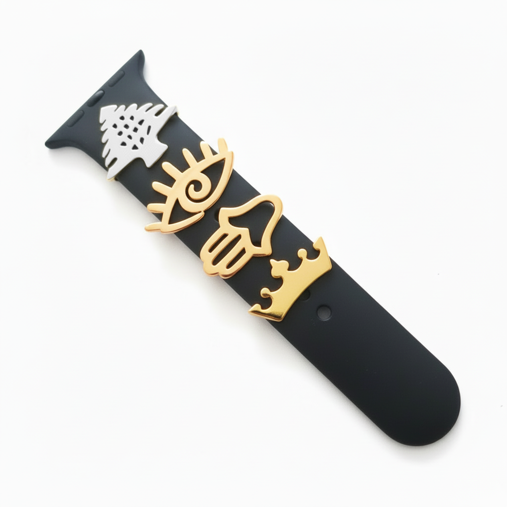 Black smartwatch with gold cedar, eye, hand, crown on the band on a white background