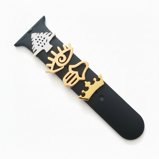 Black smartwatch with gold cedar, eye, hand, crown on the band on a white background