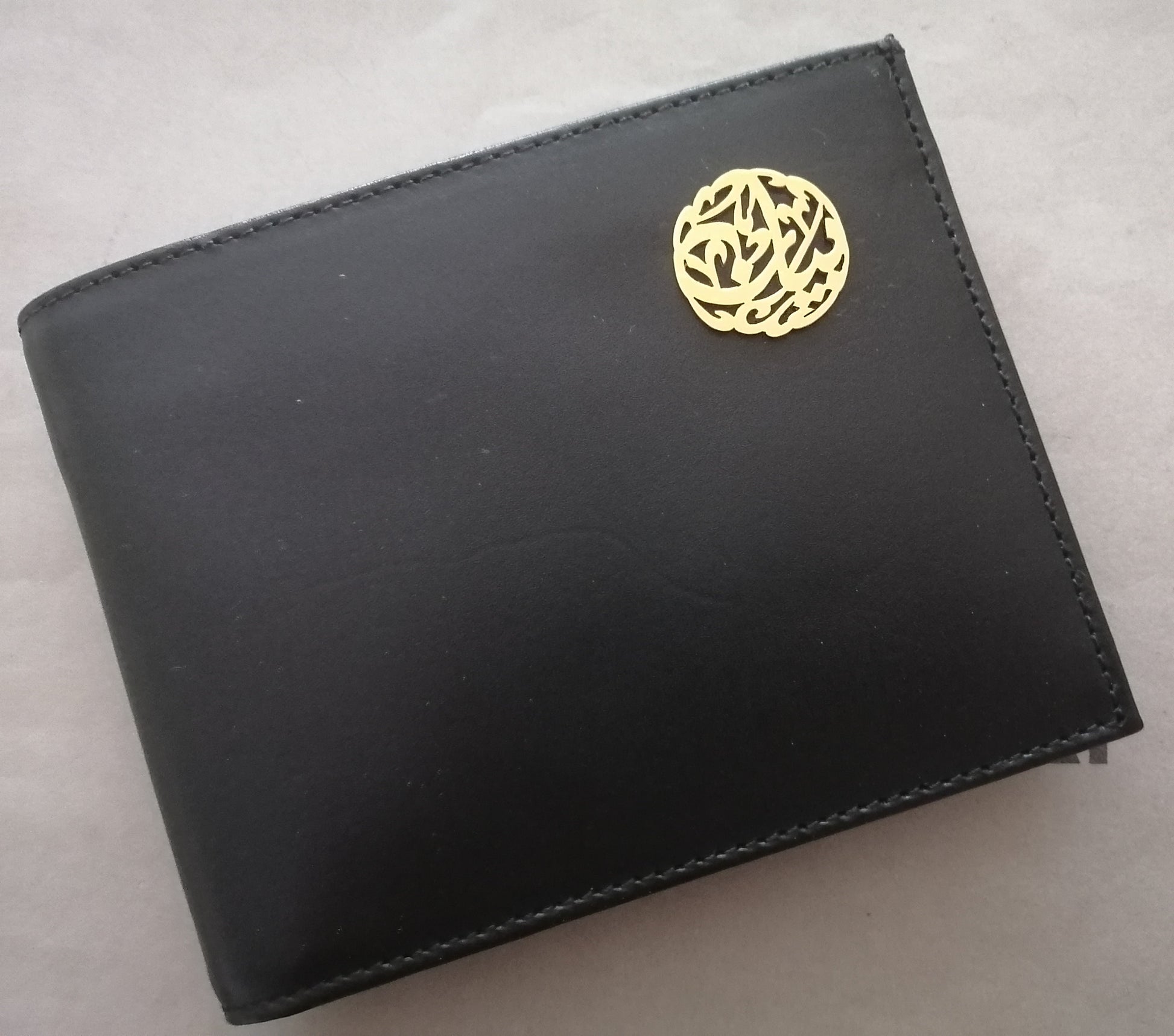 wallet black with gold name in arabic calligraphy