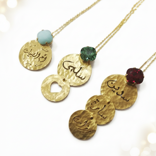 a set of 3 necklaces showing 1 name, 2 names and 3 names with cushion cut swarovski on a white background