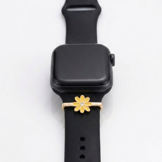 Black smartwatch with a gold flower-shaped watch band on a white background