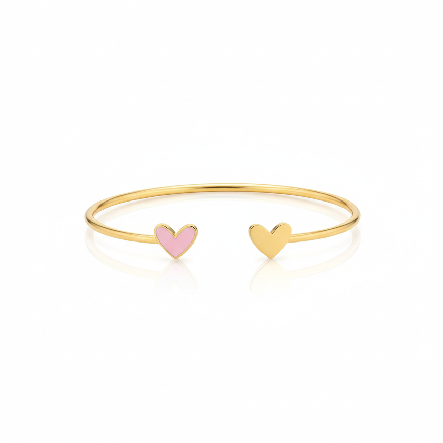 Gold bracelet with pink enamel and heart-shaped charms on a white background