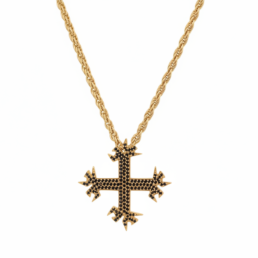 Gold necklace with a detailed cross pendant on a white background