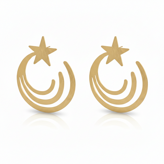 Gold earrings with star and crescent moon design on a white background