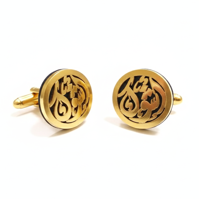 Gold cufflinks with intricate design on a white background