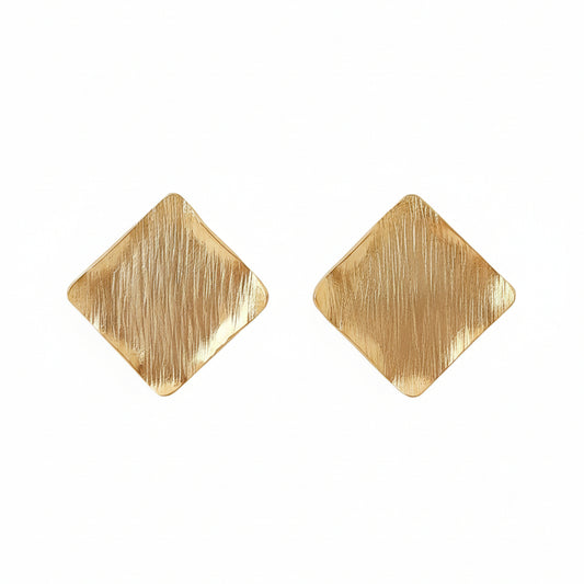 Gold square earrings against a white background