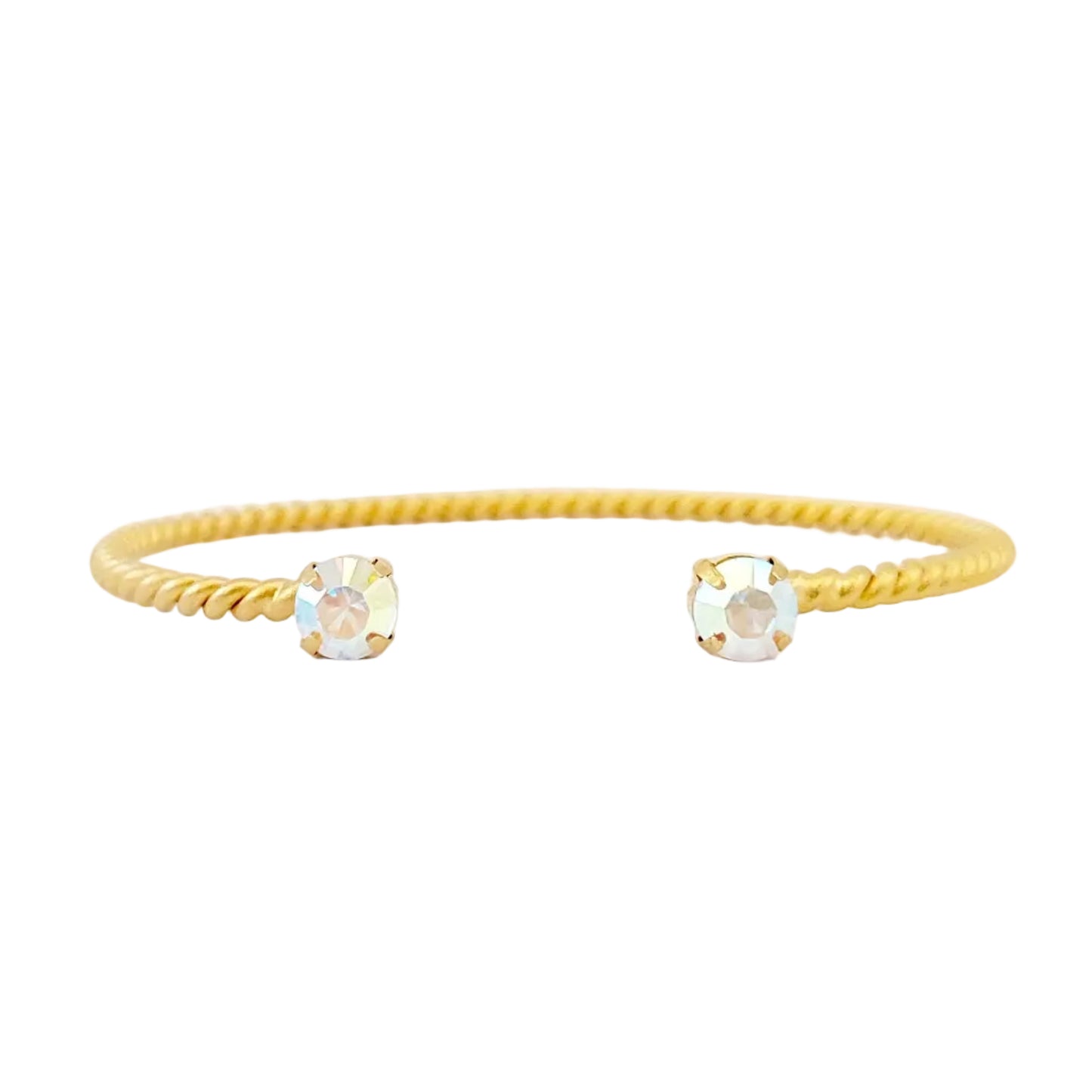 Gold bracelet with two changeant swarovski stones on a white background