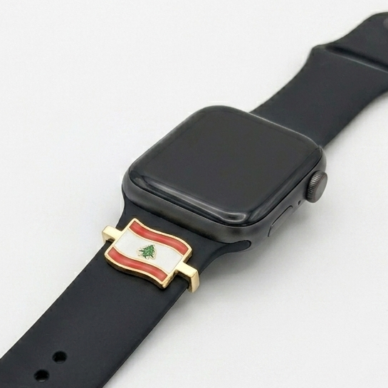 Black smartwatch with a lebanon flag watch charm on a white background