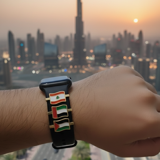 Hand wearing a watch with a flag design against a cityscape background