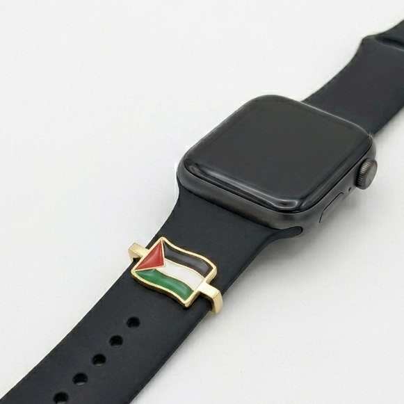 Black smartwatch with a unique band featuring a palestine flag charm on a white background