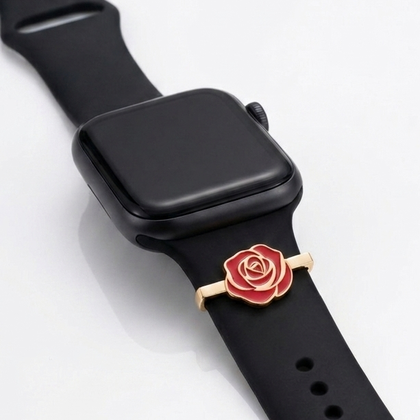 Black smartwatch with a rose gold band featuring a red rose design on a white background