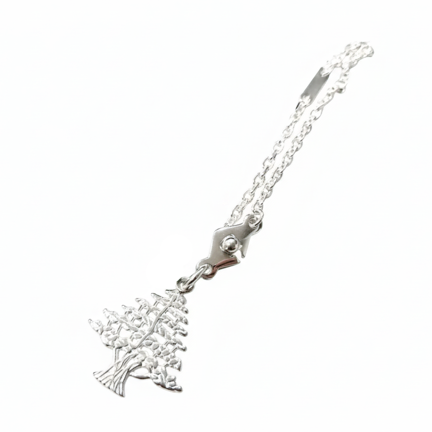 Silver keychain with a lebanese cedar charm on a white background