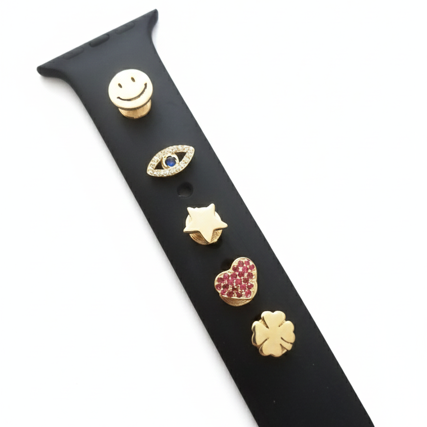Black smart watch band with gold pins shape of star, heart, clover, smiley face and eye on a white background