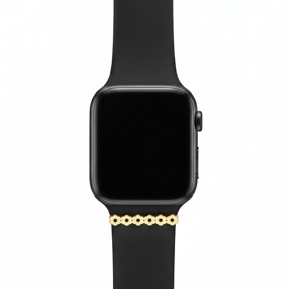 Smartwatch with a black band and flower watch charm on a white background 