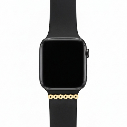 Smartwatch with a black band and flower watch charm on a white background 