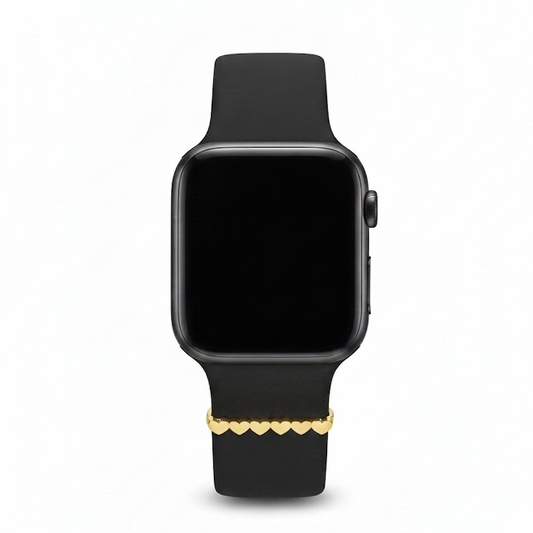 Smartwatch with a black band featuring a gold heart-shaped design watch charm on a white background