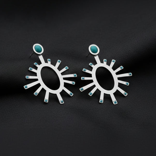 Zola Earrings - Demirelli fairuz gold on a white background