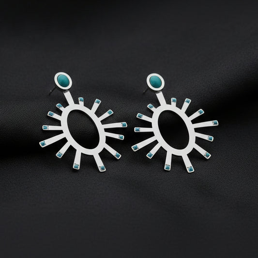 Zola Earrings - Demirelli fairuz gold on a white background